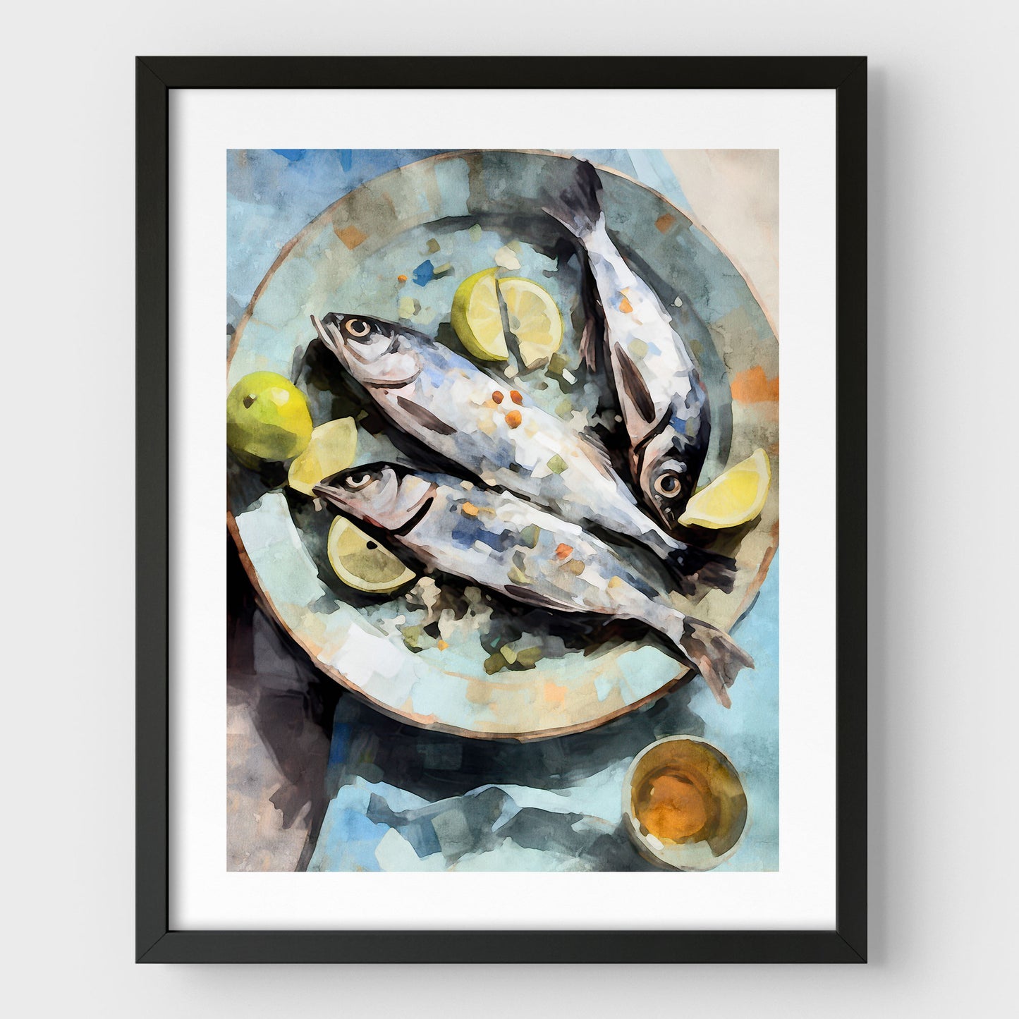 Black framed artwork with a white border featuring a watercolor-style depiction of three fresh fish on a blue plate, garnished with lemon wedges and limes, accompanied by a small dish.
