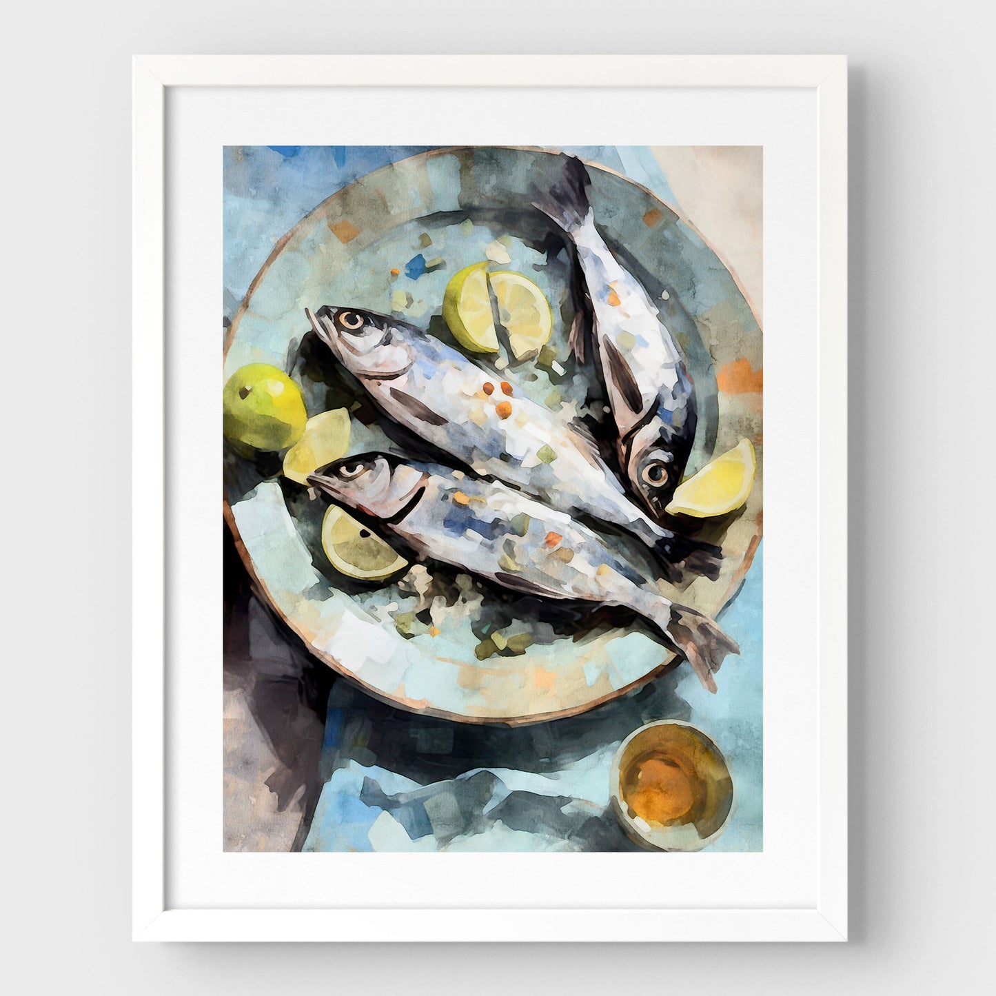 White framed artwork with a white border featuring a watercolor-style depiction of three fresh fish on a blue plate, garnished with lemon wedges and limes, accompanied by a small dish.