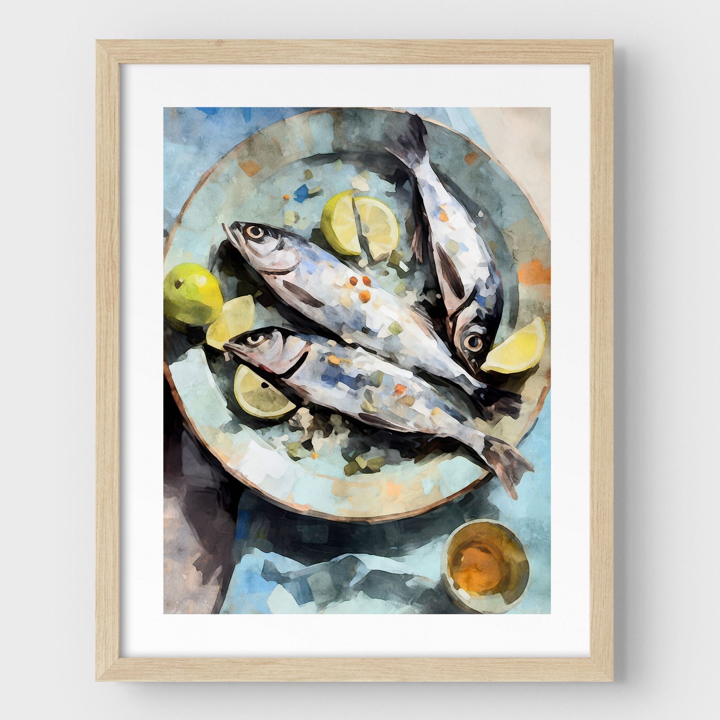 Natural wood framed artwork with a white border featuring a watercolor-style depiction of three fresh fish on a blue plate, garnished with lemon wedges and limes, accompanied by a small dish.