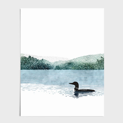 Minimalist watercolor illustration of a solitary common loon gliding across a calm blue lake. The black bird with a red eye floats in the foreground, leaving gentle ripples in the water. Soft, layered green tree lines and misty hills stretch across the horizon, with a large expanse of white sky creating a quiet, peaceful, nature-inspired composition.