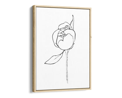Natural wood framed canvas print of a minimalist line drawing depicting a peony bud with a single leaf, set against a white background.