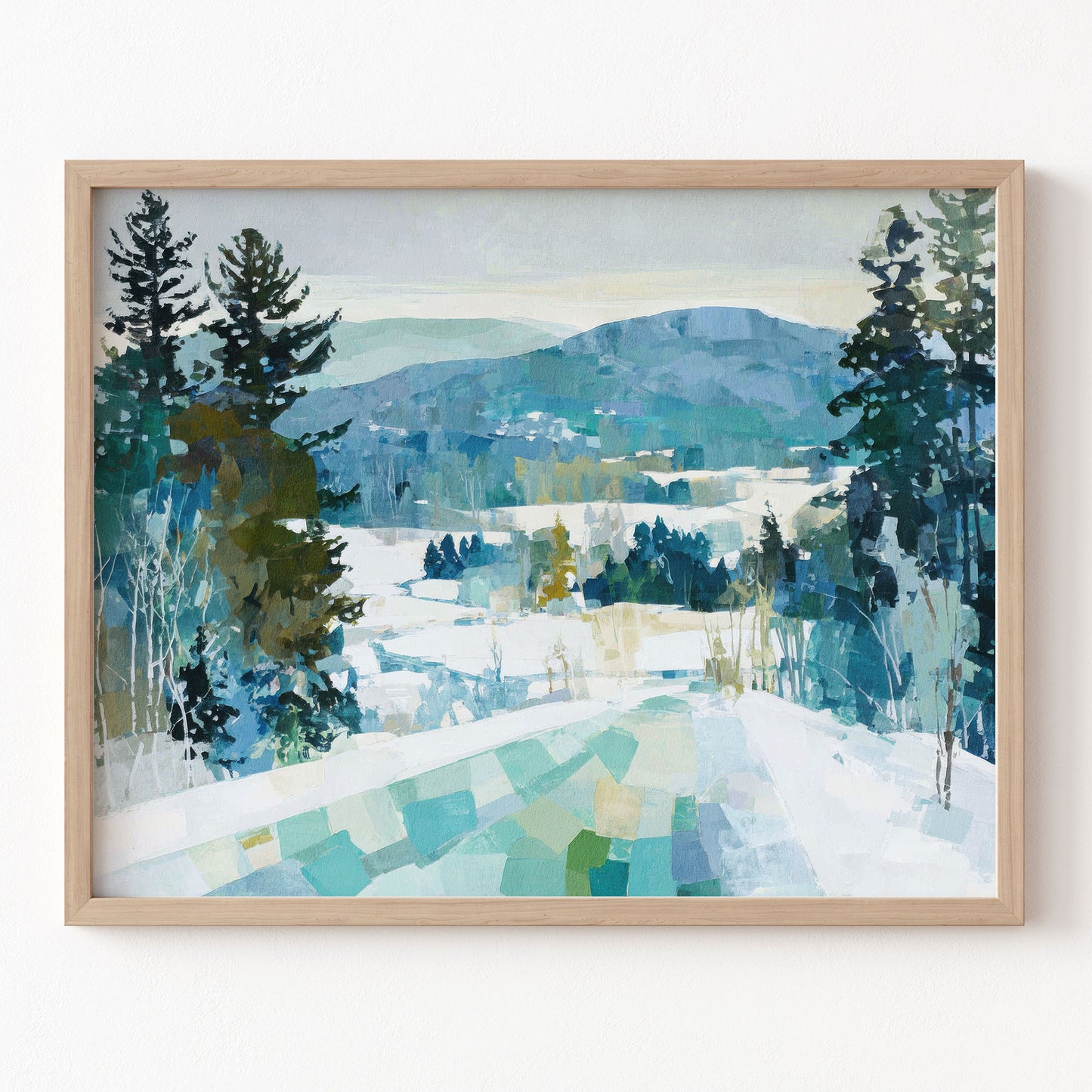 Framed painting of a snowy landscape with trees and mountains