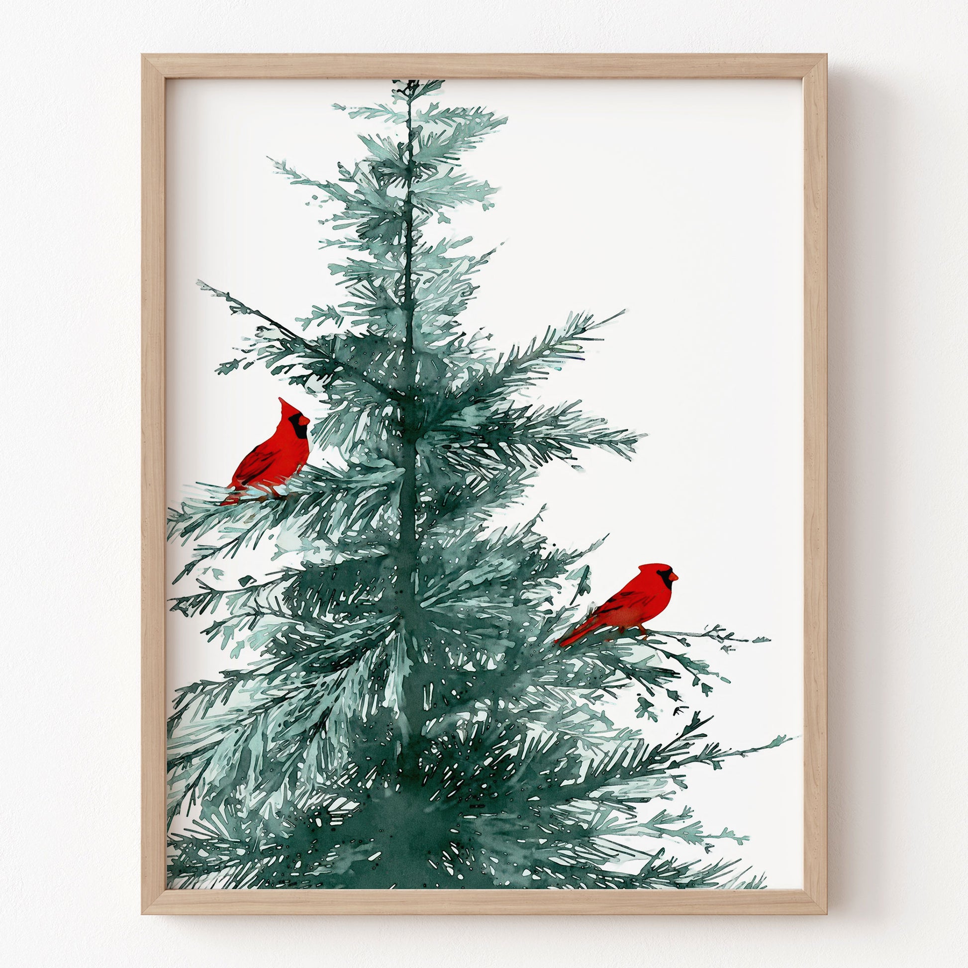 Framed artwork of a Christmas tree with red cardinals on a white background