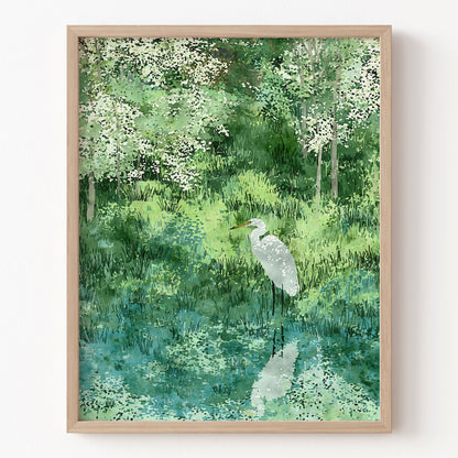 Framed artwork of a white egret in a forest setting