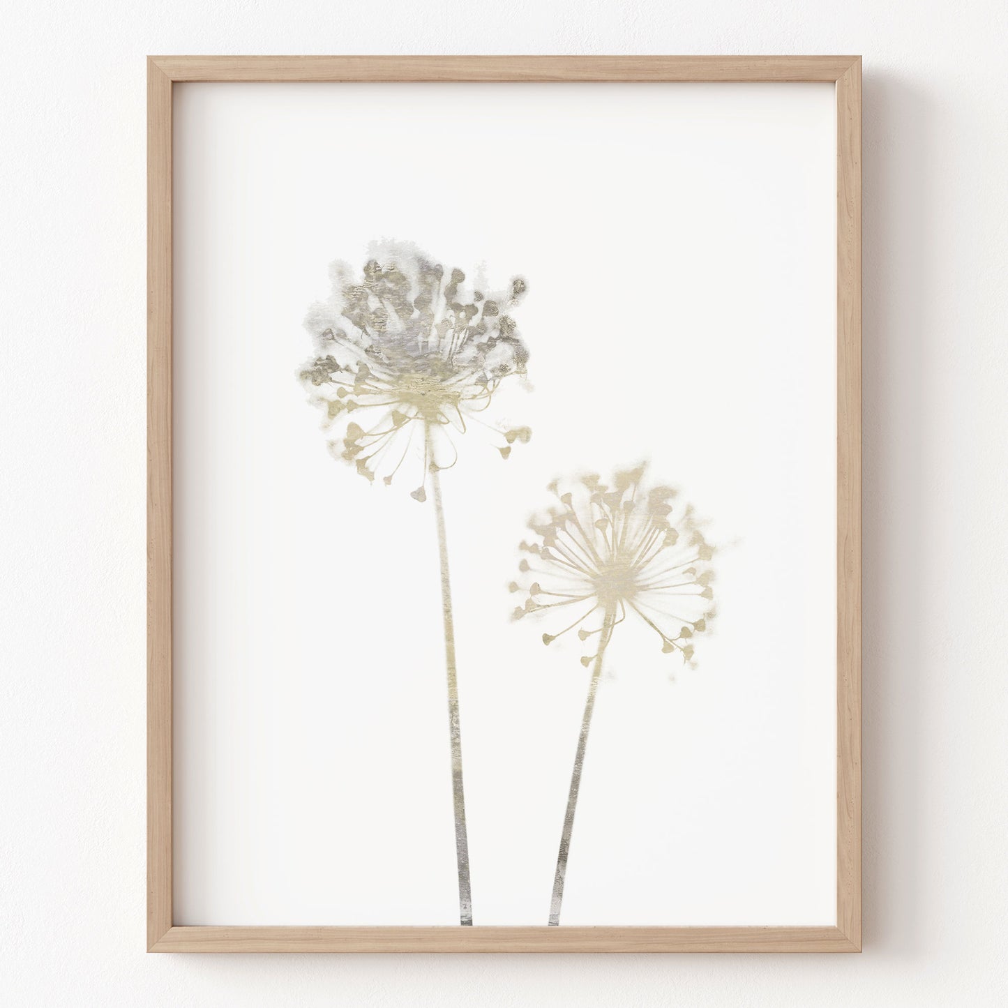 Framed artwork of two floral silhouettes on a white background