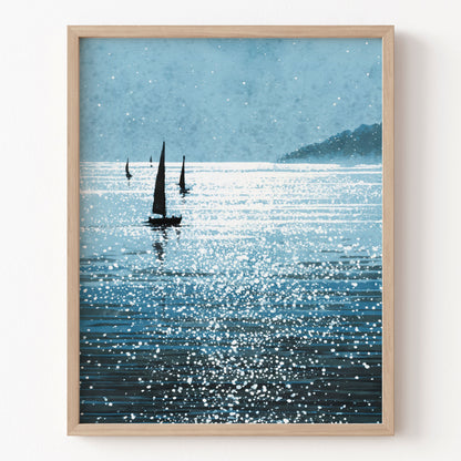 Framed artwork of sailboats on a sparkling water surface with a mountain in the background.