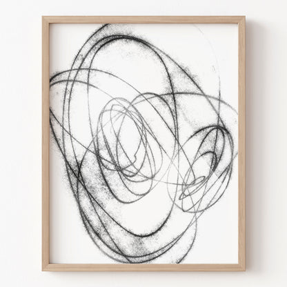 Framed abstract art with black lines on a white background