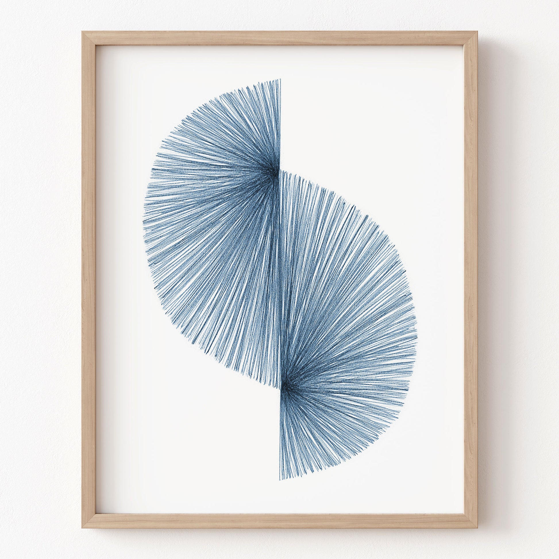 Framed abstract art piece with blue circular design on a white background