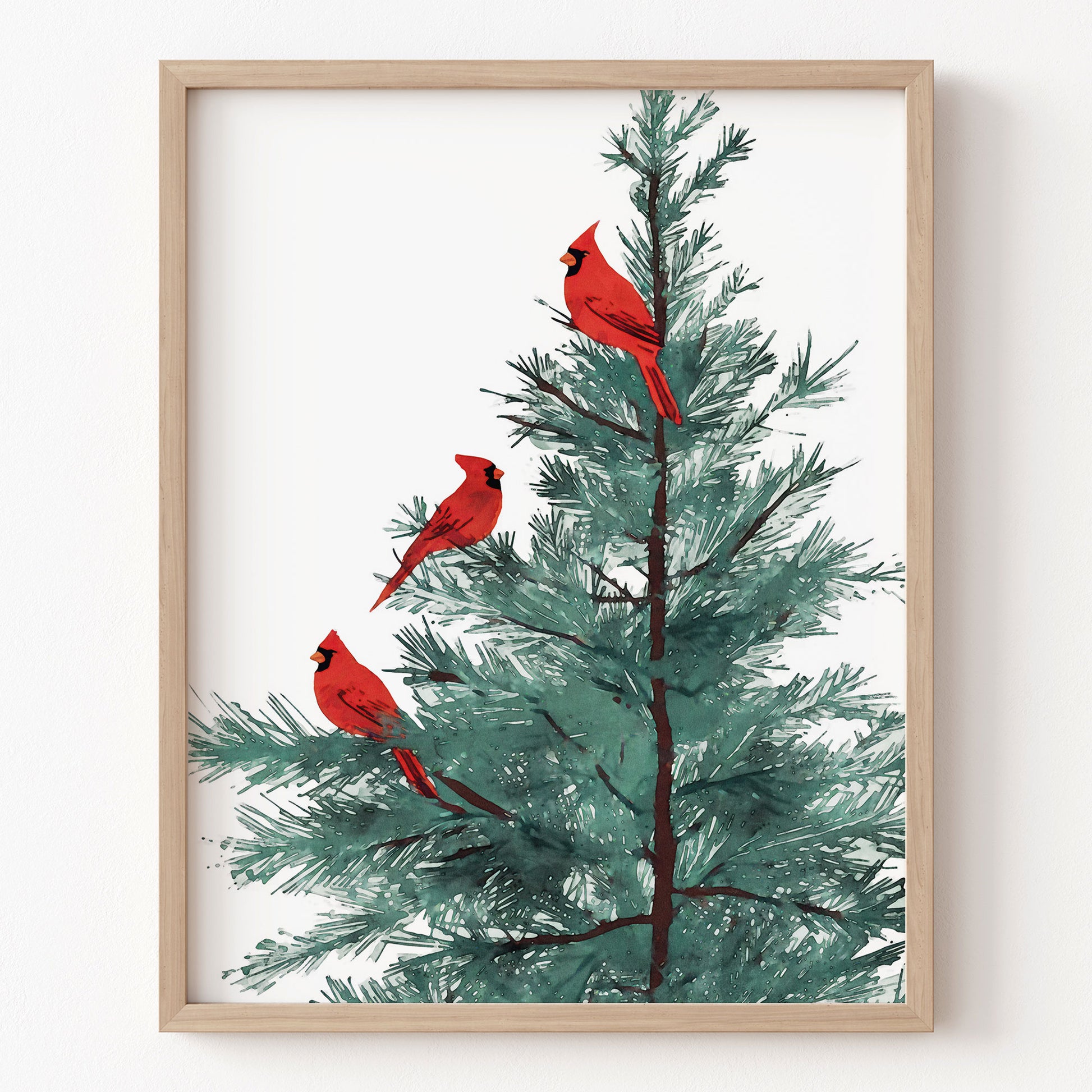 Framed artwork of three red cardinals on a tree with a wooden frame.