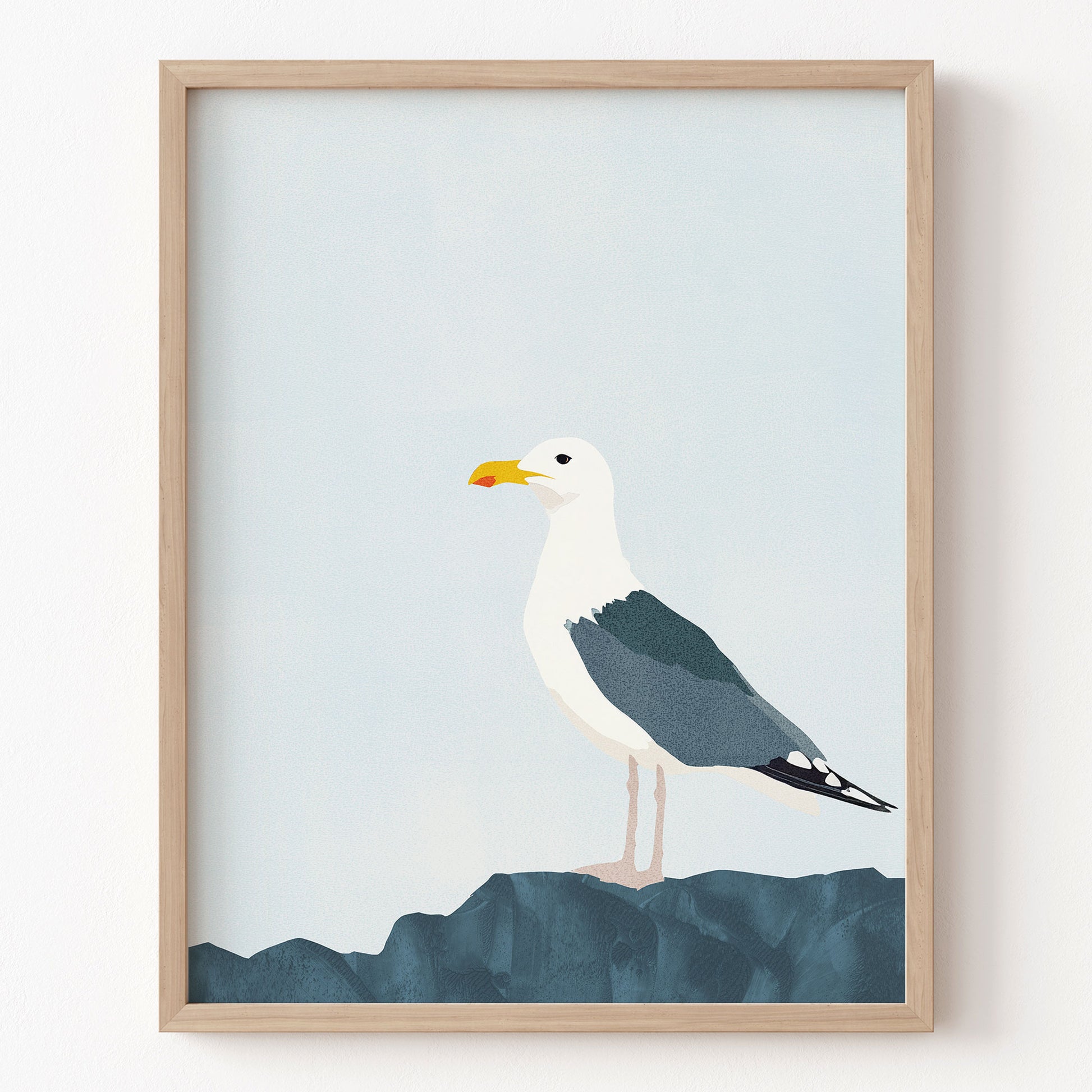 Framed artwork of a seagull on a blue background