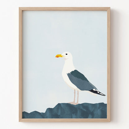 Framed artwork of a seagull on a blue background