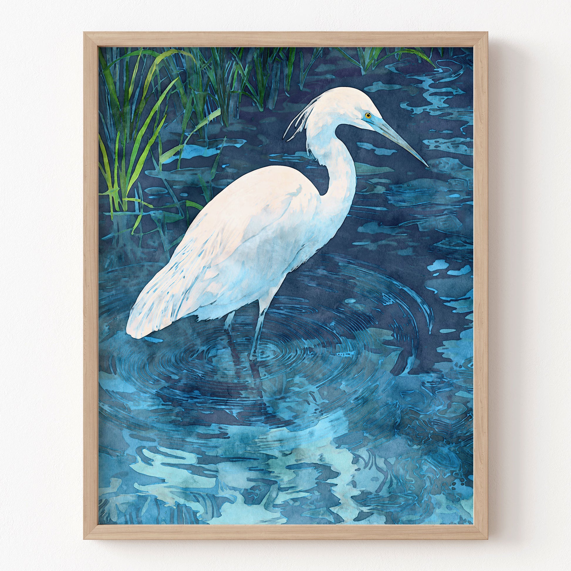 Framed artwork of a white egret in water with a natural background
