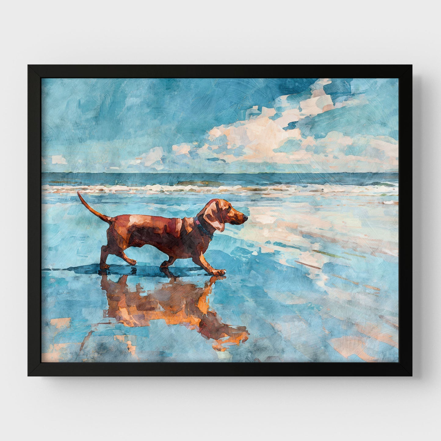 Framed watercolor-style beach scene of a red dachshund walking along the shoreline, its reflection mirrored in wet sand. Soft ocean waves and a blue sky with white clouds create a calm, airy coastal mood, presented in a sleek black frame.