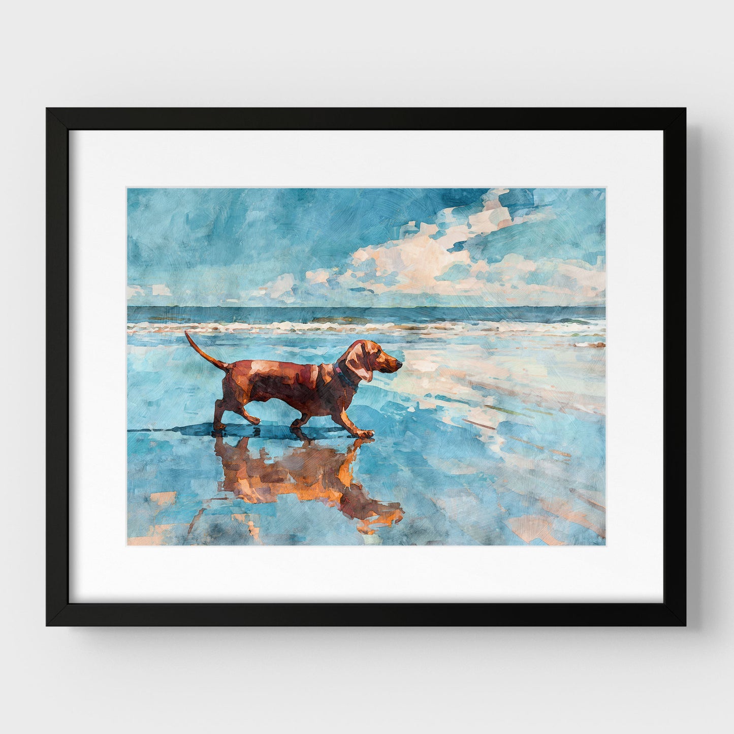 Framed watercolor-style beach scene of a red dachshund walking along the shoreline, its reflection mirrored in wet sand. Soft ocean waves and a blue sky with white clouds create a calm coastal feel, displayed with a white mat and black frame for a clean, modern presentation.