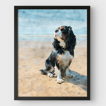 Black framed artwork of a tricolor King Charles spaniel on a beach