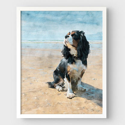 White framed artwork of a tricolor King Charles spaniel on a beach