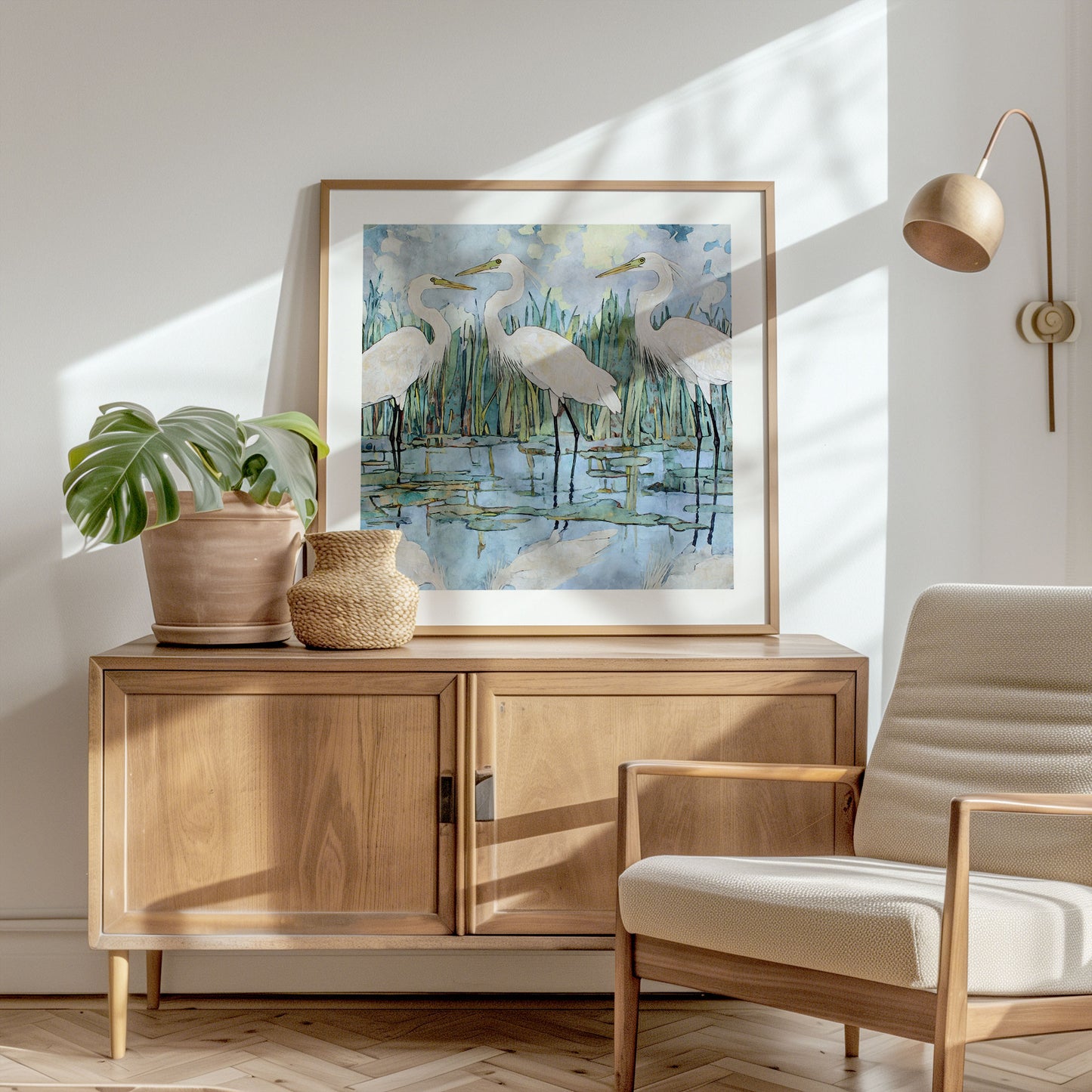 Living room with wooden sideboard, chair, and framed artwork of birds.