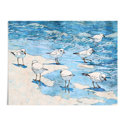 Watercolor and ink illustration of seven small white shorebirds with orange beaks and legs, standing and wading in shallow blue water along a sandy shoreline. Gentle waves in layered shades of blue ripple across the background, while soft shadows and reflections add depth to the scene. The composition blends fluid brushstrokes with fine black outlines for a lively coastal feel.